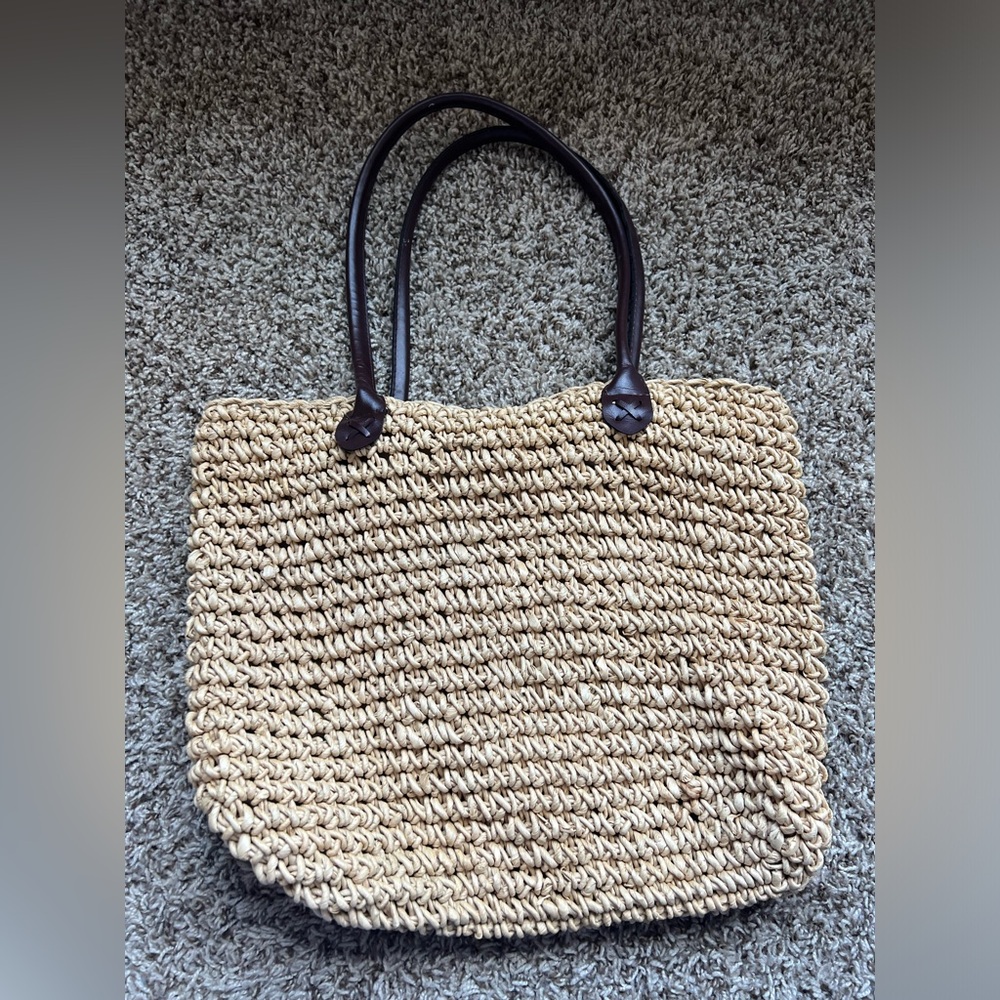 STRAW BAG unbranded, liner with inside pocket.
